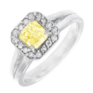 A diamond ring with a yellow center stone.