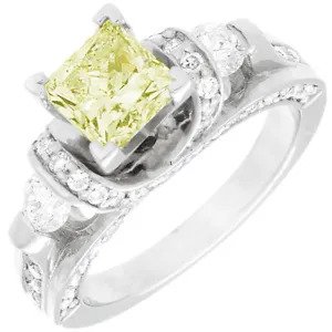 A diamond ring with a yellow center stone.